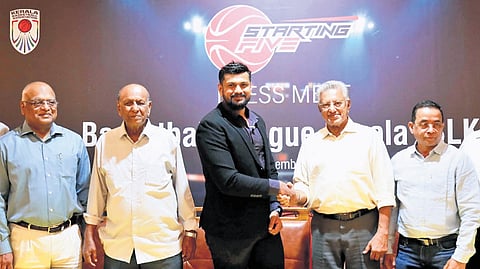 P Jacob, MD, Starting Five Sports Management, and Anirudh Pole, CEO & founder , Abcff League, announcing the Basketball League Kerala in Kochi on Monday. KBA life president P J Sunny, president Jacob Joseph, secretary P C Antony, Starting Five promoter Ajikumar Nair and director Koshy Abraham are also seen