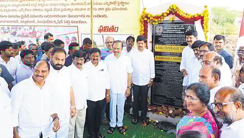 Ministers Kollu Ravindra and DSBV Swamy after laying the foundation stone for a development project in Prakasam district on Sunday.