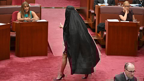 One Nation Leader Pauline Hanson wears a burqa in the Senate chamber at Parliament House in Canberra, Monday, Nov. 24, 2025.