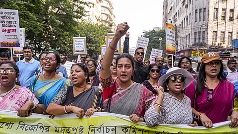 Booth level officers who are engaged in the ongoing special intensive revision (SIR) of electoral rolls in West Bengal raise slogans during a protest march to the office of the Chief Electoral Officer (CEO over alleged excessive work pressure, in Kolkata, Monday, Nov. 24, 2025.