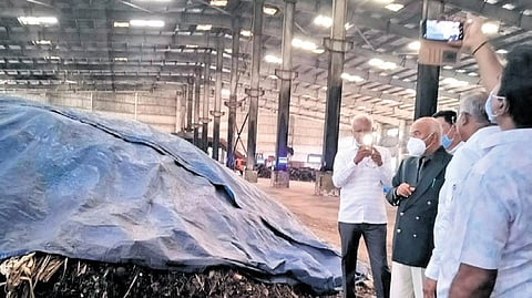 Upa Lokayukta Justice K N Phaneendra (green blazer) inspects the Lingadheeranahalli Solid Waste Management Plant