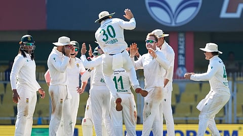 South Africa's players celebrate the dismissal of India's Washington Sundar on the fifth day of the second cricket test match between India and South Africa in Guwahati, India, Saturday, Nov 22, 2025