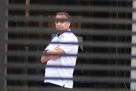 Brazil’s former President Jair Bolsonaro stands at the entrance of his home where he is under house arrest in Brasilia, Brazil, Tuesday, Sept. 2, 2025.