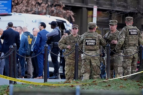 Emergency personnel gather in a cordoned off area where National Guard soldiers were shot near the White House Wednesday, Nov. 26, 2025, in Washington.
