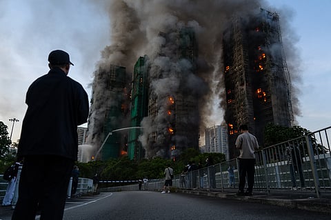 Smoke rises after a fire broke out at Wang Fuk Court, a residential estate in the Tai Po district of Hong Kong's New Territories on Wednesday, Nov. 26 2025.