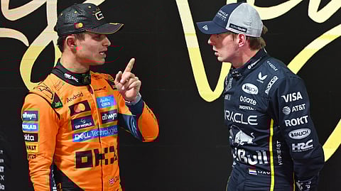 Lando Norris of McLaren (L) and Max Verstappen of Red Bull Racing