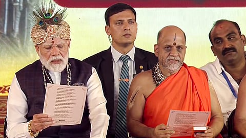 Prime Minister Narendra Modi with Paryaya Puttige Mutt seer Sri Sugunendra Theertha Swamiji during 'Laksha Kantha Gita Parayana' programme at Sri Krishna Mutt, in Udupi, Karnataka.