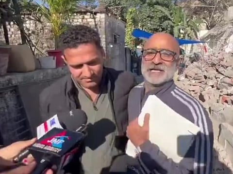 Kuldip Sharma (R) with journalist Arfaz Ahmad Daing (L)