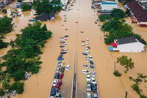Cars and houses are submerged in floodwaters in the Songkhla province of southern Thailand, Nov. 26, 2025.