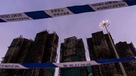 Burned buildings are seen at the scene of the fire at Wang Fuk Court, a residential estate in the Tai Po district of Hong Kong's New Territories, Friday, Nov. 28 2025.