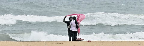Visitors at Marina Beach were seen venturing close to the shoreline on Friday, despite the rough tides triggered by Cyclone Ditwah, which is expected to make landfall near the Chennai coast
