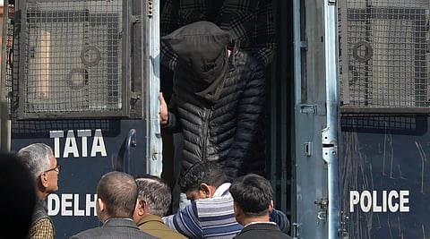 An accused in the Red Fort blast case being brought to the Patiala House Court in New Delhi.