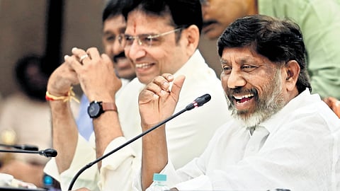 Deputy Chief Minister Mallu Bhatti Vikramarka shares a lighter moment with journalists during a presentation on energy in Hyderabad.