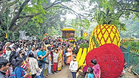 Floral display of Hampi chariot, Karnataka map, fish; Visitors pose with a flower-decked butterfly. which started on November 27, will conclude on December 7.