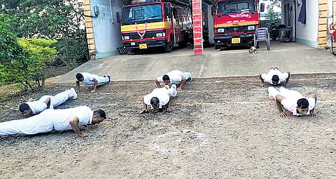 Fire personnel doing push-ups