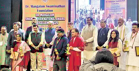 Awardees pose for a photograph during the award ceremony on Saturday