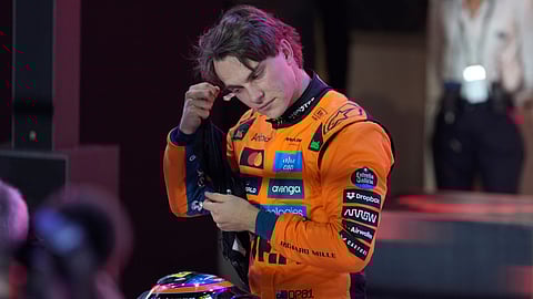 McLaren driver Oscar Piastri of Australia gestures after setting the pole position in the sprint qualifying at the Lusail International Circuit ahead of the Qatar Formula One Grand Prix, in Lusail, Qatar, Friday, Nov. 28, 2025.