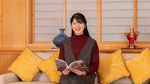 In this photo provided by the Imperial Household Agency of Japan, Princess Aiko, the daughter of Japan's Emperor Naruhito and Empress Masako, poses for a photo at the Imperial Palace in Tokyo, Friday, Nov. 7, 2025.