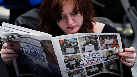 Columbia College Chicago student Kailey Ryan reads a newspaper in Chicago on Nov 5, 2024.