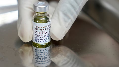 A pharmacist holds a vial of lenacapavir, an injectable HIV prevention drug, at the Desmond Tutu Health Foundation's Masiphumelele Research Site, in Cape Town.