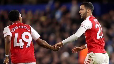 Mikel Merino of Arsenal celebrates scoring his team's first goal with teammate Myles Lewis-Skelly