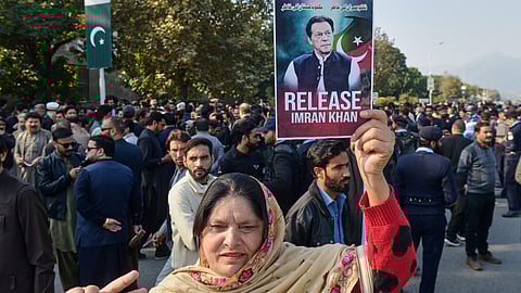 Supporter of Pakistan's imprisoned former Prime Minister Imran Khan hold a demonstration outside Islamabad High Court, in Islamabad, Pakistan, Tuesday, Dec. 2, 2025