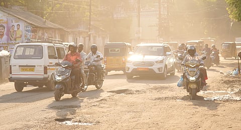 Heavy dust causing inconvenience to commuters on Jail Road, in Madurai, on Tuesday.
