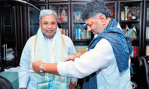 Deputy Chief Minister DK Shivakumar welcomes CM Siddaramaiah at his residence for breakfast in Bengaluru.