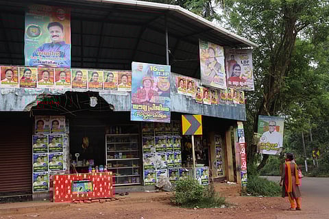 A building at Muttappalam near Varkala in Thiruvananthapuram is seen almost entirely covered with candidates' pictures ahead of the Assembly elections.