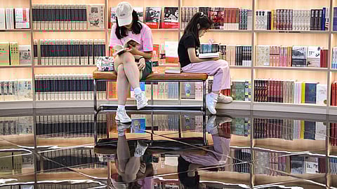 People read books at a book store in Shenzhen, China’s southern Guangdong province