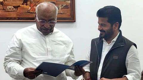 Chief Minister A Revanth Reddy hands over a Global Summit invitation to AICC president Mallikarjun Kharge in Delhi on Tuesday.