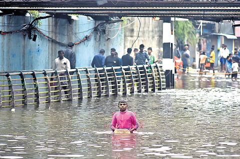 The Ganeshpuram subway at Vyasarpadi was flooded on Tuesday; (Below) children playing at Perambur.