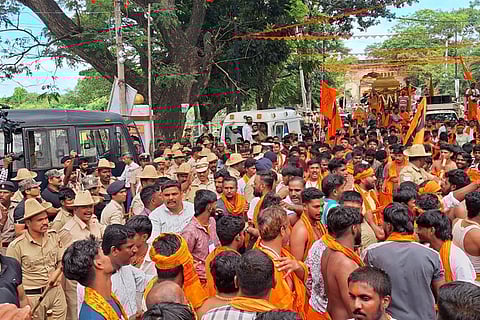 3tight---Hundreds of devotees take part inHanuma Mala Sankeerthana Yatra in Srirangapatna in Mandya district on Wednesday.