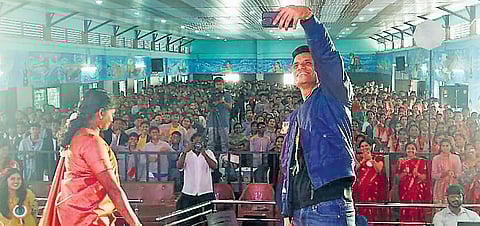 Group Captain Shubhanshu Shukla takes a selfie with St Philomena students