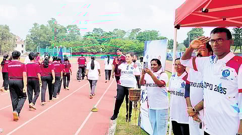 Dr Selvan P, president, IAPMR-Kerala, salutes the children participating in the march past during the special sports meet held at Lakshmibai National College of Physical Education in Thiruvananthapuram 