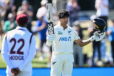 New Zealand's Rachin Ravindra celebrates after making 100 runs against the West Indies on day 3 during their cricket test match in Christchurch, New Zealand, Thursday, Dec. 4, 2025.