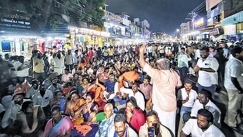 Scores of Hindu outfit members at the entrance of the foothills awaiting permission to ascend the hill.