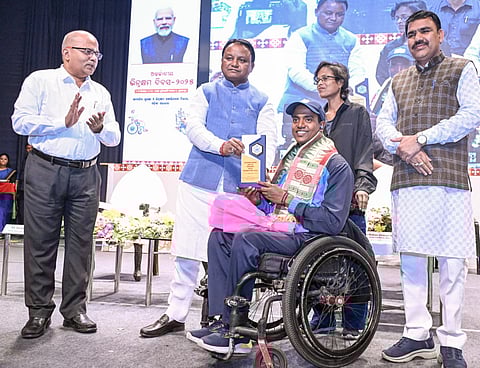 CM Mohan Charan Majhi felicitating a differently-abled youth | Express