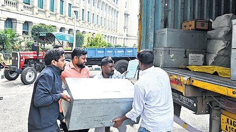 Vidhana Soudha staffers shift documents of winter session into a truck that will be travelling to Belagavi.