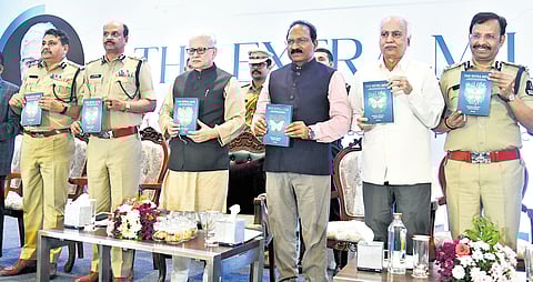 Governor Jishnu Dev Varma, DGP B Shivadhar Reddy and Hyderabad Commissioner of Police VC Sajjanar during the launch of the book, ‘The Extra Mile’ on Friday