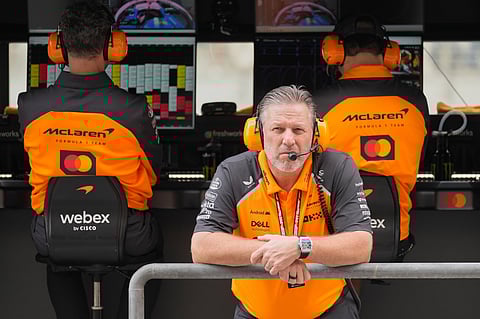 McLaren chief Zak Brown listens to radio during a first practice for the he Abu Dhabi Formula One Grand Prix in Abu Dhabi.