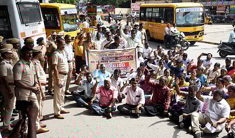 Tamil Nadu Government Employees Association staging road roko in front of the collectorate office vellore on Thursday.