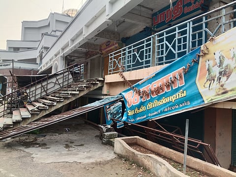 A broken staircase grill that recently fell and tore a shops banner in the Victoria Complex in Salem.