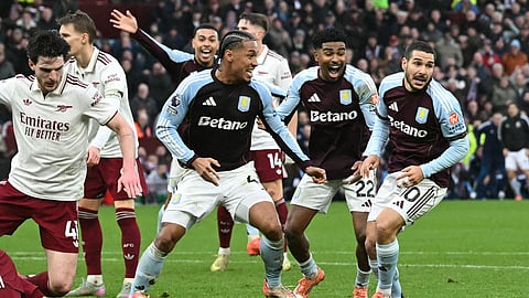 Aston Villa's Argentinian midfielder #10 Emiliano Buendia (R) celebrates scoring the team's second goal during the English Premier League football match against Arsenal at Villa Park in Birmingham. (Photo | AFP)