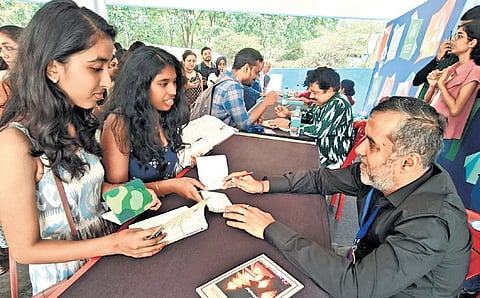 Writer Chetan Bhagat interacts with his fans at Bengaluru Literature Festival, at Freedom Park, on Sunday
