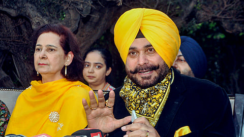Congress leader Navjot Singh Sidhu, along with his wife, Navjot Kaur Sidhu, addresses a press conference in Amritsar.