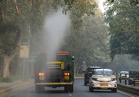 An anti-smog gun being used to spray water droplets to curb air pollution, in New Delhi, Sunday, Dec. 7, 2025.