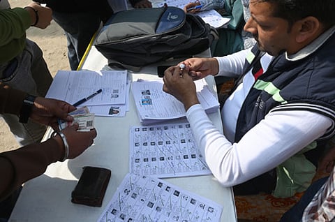 BLOs helping voters fill thier enumeration forms part of the statewide Special Intensive Revision (SIR) of the electoral roll at a special camp.