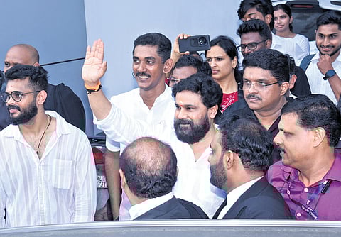 Actor Dileep waving at fans outside the Ernakulam district court on Monday