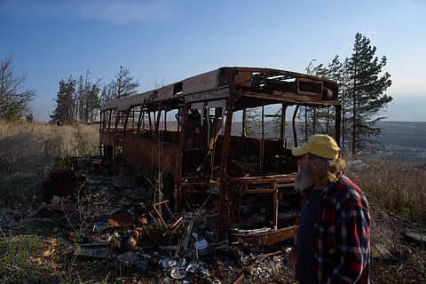 Ilan Rosenfeld walks through the burnt-out shell of his business in Israel's northernmost town of Metula, Sunday, Nov. 30, 2025